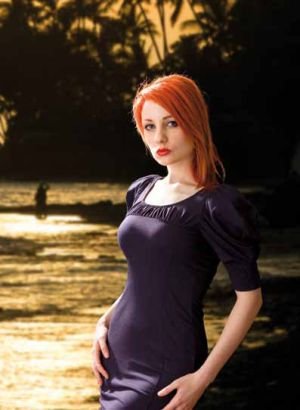 Model posing with low-light bay background